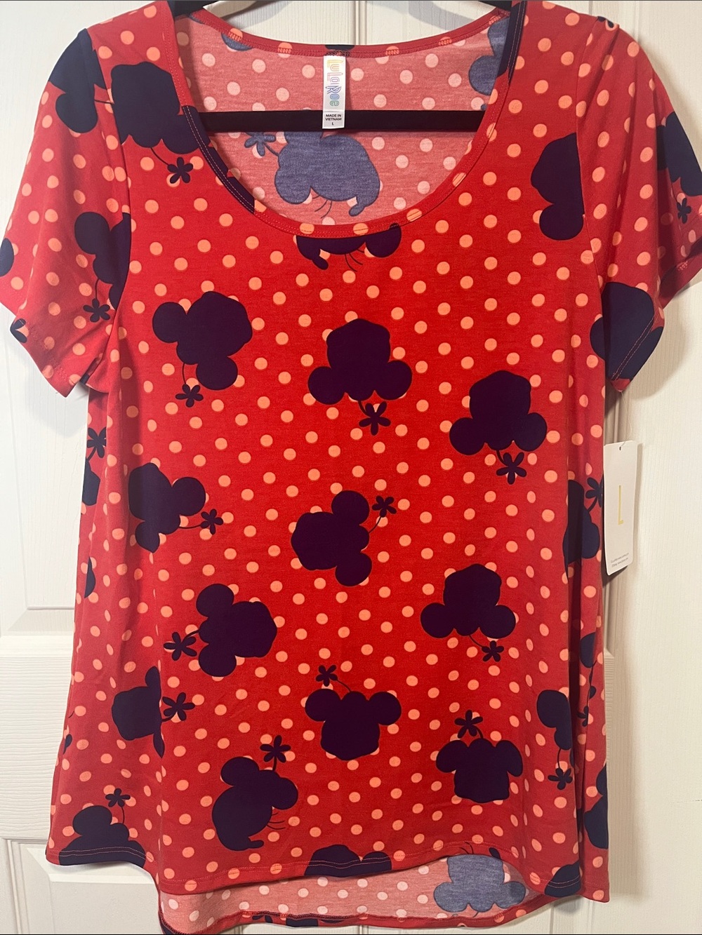 LuLaRoe Red Polka Dot Short Sleeve Top with purple Floral Shapes